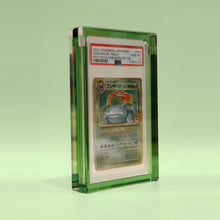 Emerald Green Card Guard at an angle on an emerald background, showing the depth of the acrylic frame