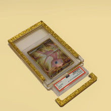 Royal Gold Card Guard open on a gold background with the PSA slab lifting out
