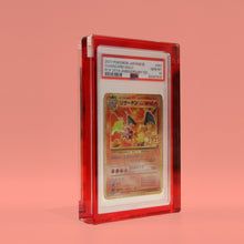 Ruby Red Card Guard at an angle on a ruby background, showing the depth of the acrylic frame