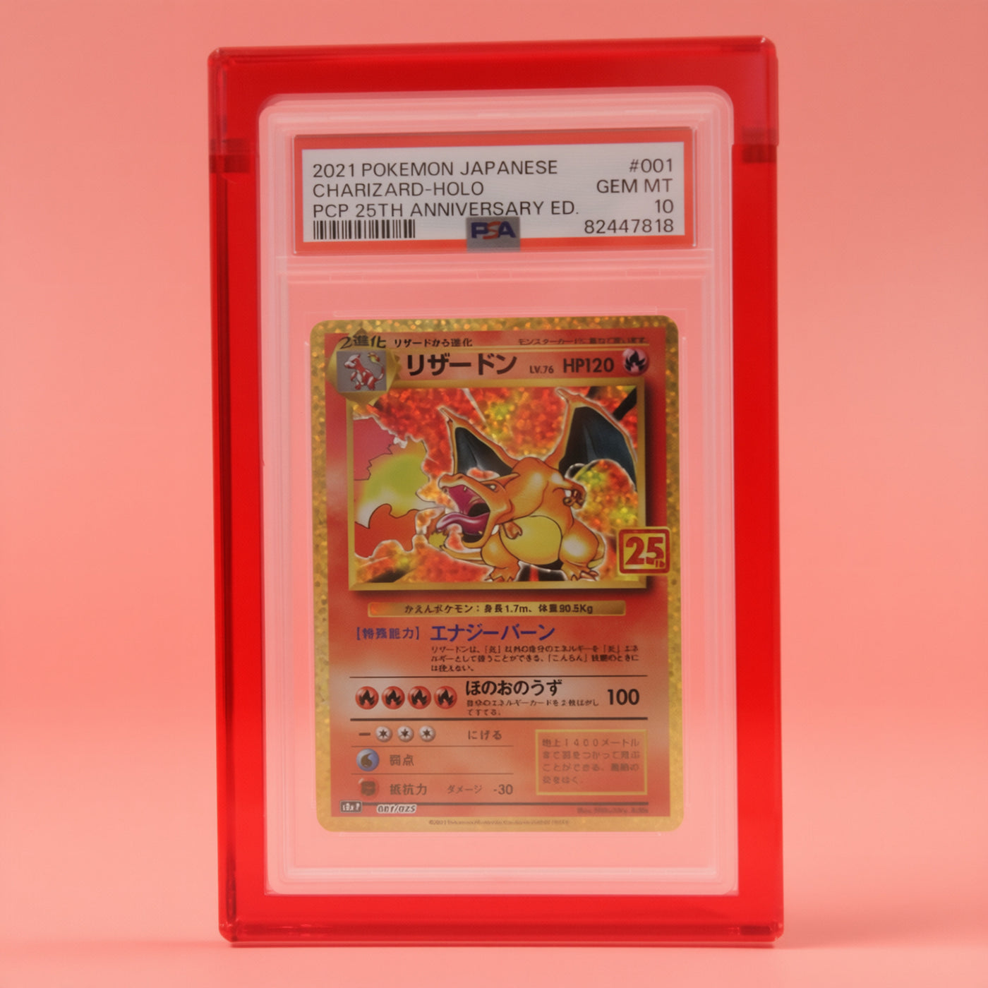 Ruby Red Card Guard on a ruby background, holding a PSA graded Charizard slab